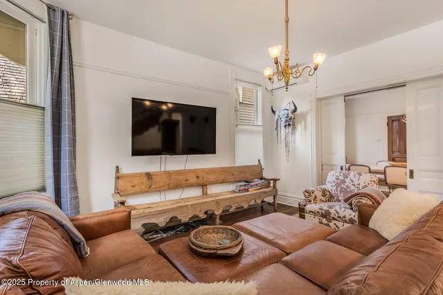 a bedroom with a bed and a mirror