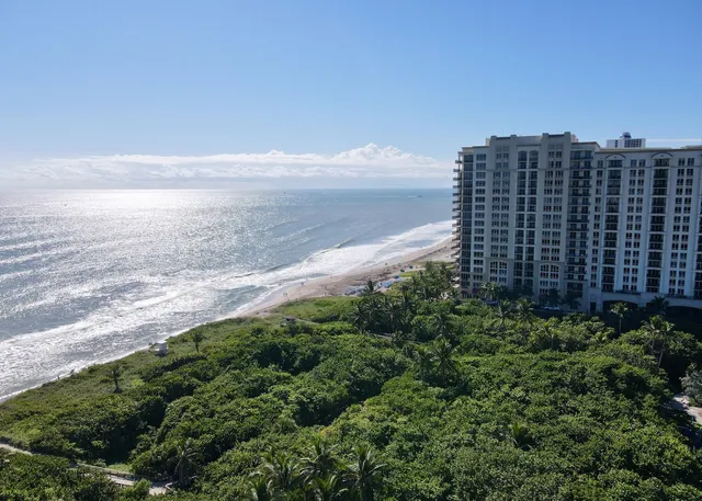 a dining room with wooden floor table and chairs