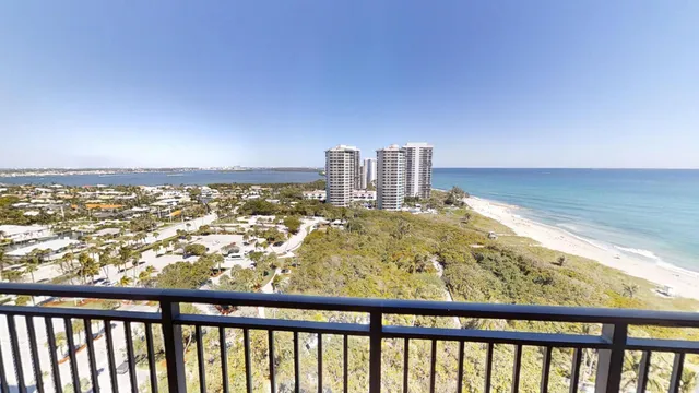 a kitchen with a sink a stove and chairs