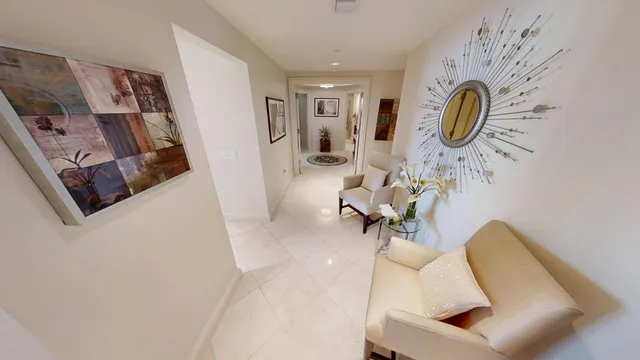 a view of a dining room with furniture and chandelier