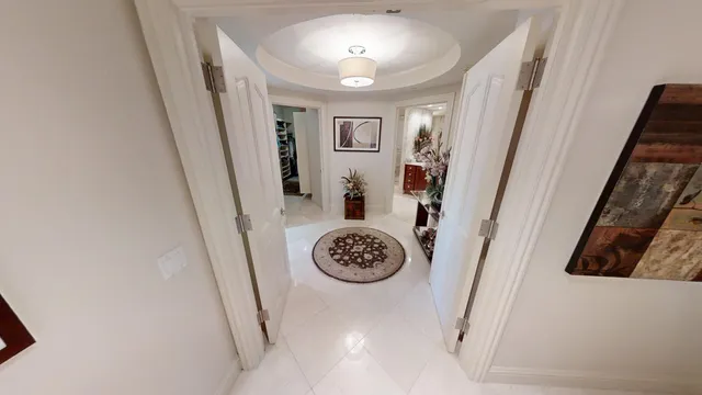 a bathroom with a sink a toilet a mirror and shower