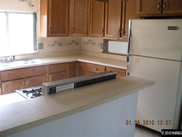 16085 Rhyolite Circle Reno, NV 89521 - Photo 5 of 9 a kitchen with a sink and a window