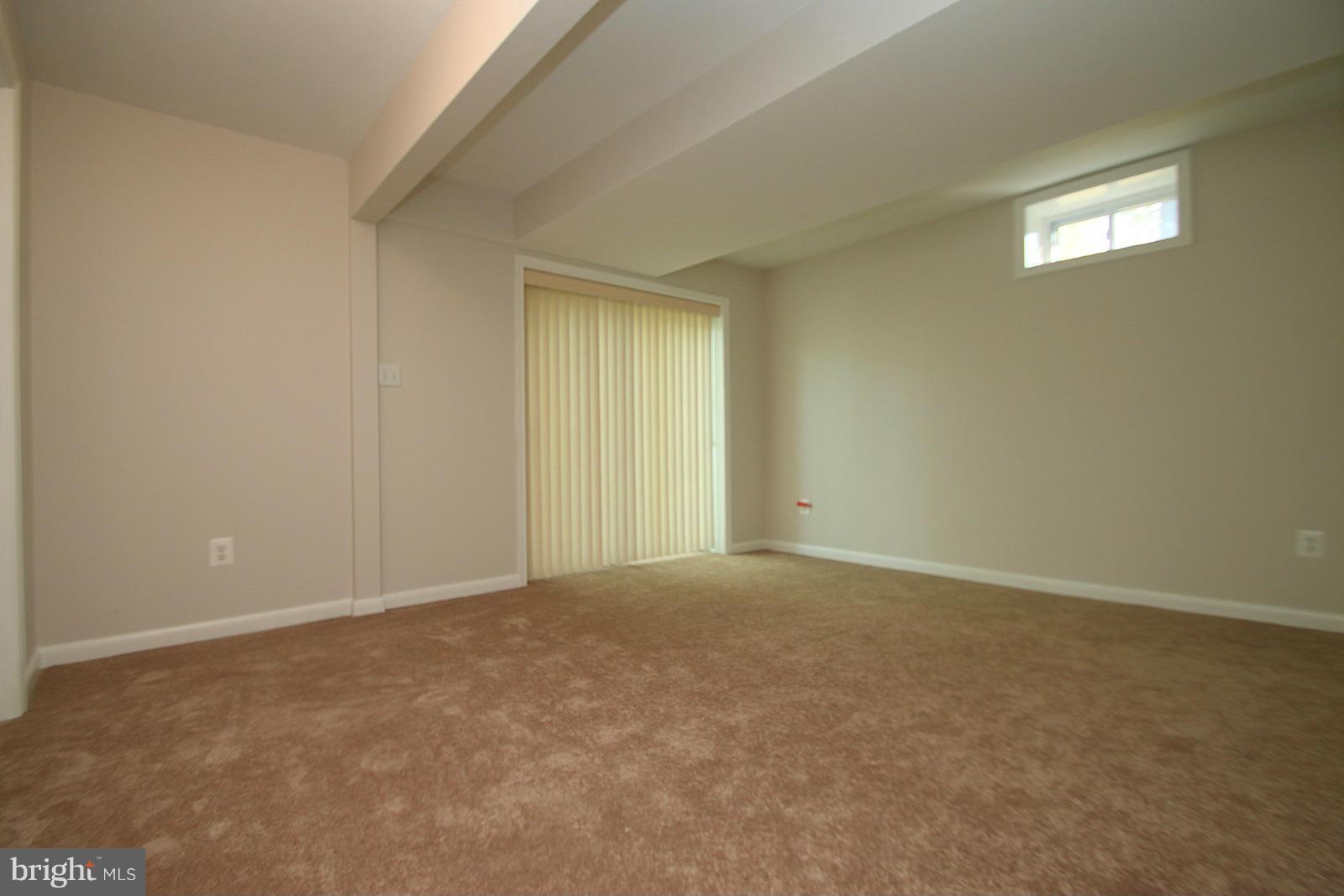 13205 Choptank Road Baltimore, MD 21220 - Photo 11 of 30 an empty room with a natural light