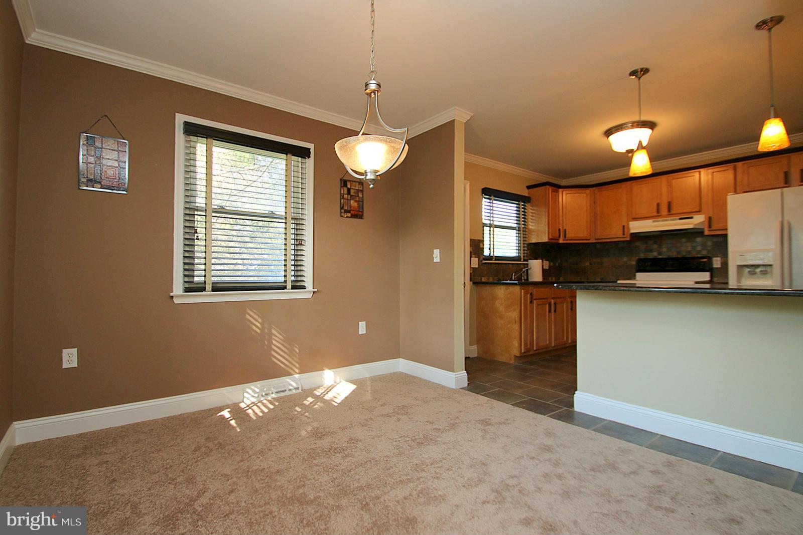 13205 Choptank Road Baltimore, MD 21220 - Photo 17 of 30 a view of a kitchen with a stove cabinets and a kitchen