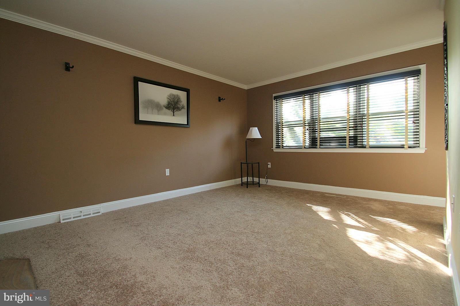 13205 Choptank Road Baltimore, MD 21220 - Photo 18 of 30 a view of an empty room with a window