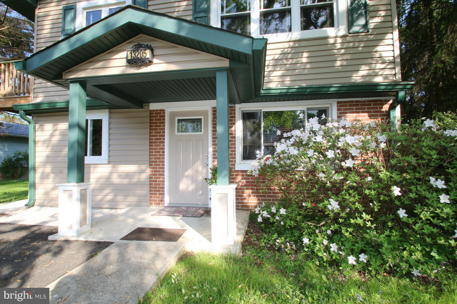 13205 Choptank Road Baltimore, MD 21220 - Photo 3 of 30 a view of a house with a small yard