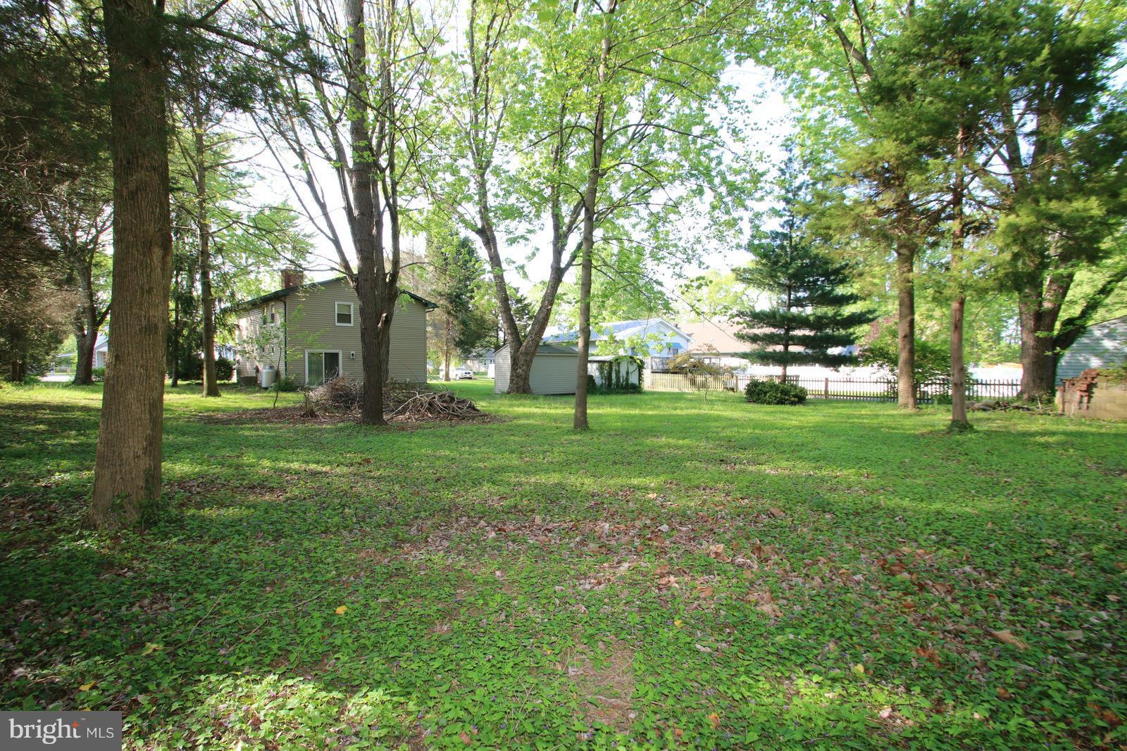 13205 Choptank Road Baltimore, MD 21220 - Photo 28 of 30 a backyard of a house with lots of green space and fountain
