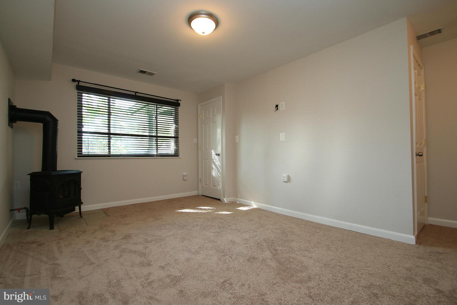 13205 Choptank Road Baltimore, MD 21220 - Photo 10 of 30 an empty room with windows