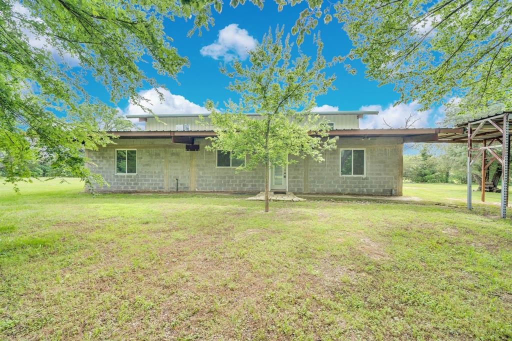 10476 County Road 313 Terrell, TX 75161 - Photo 32 of 40 a front view of a house with a garden