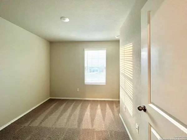 a view of a room with a window