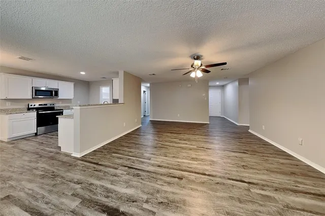 a view of a kitchen with a sink and a stove