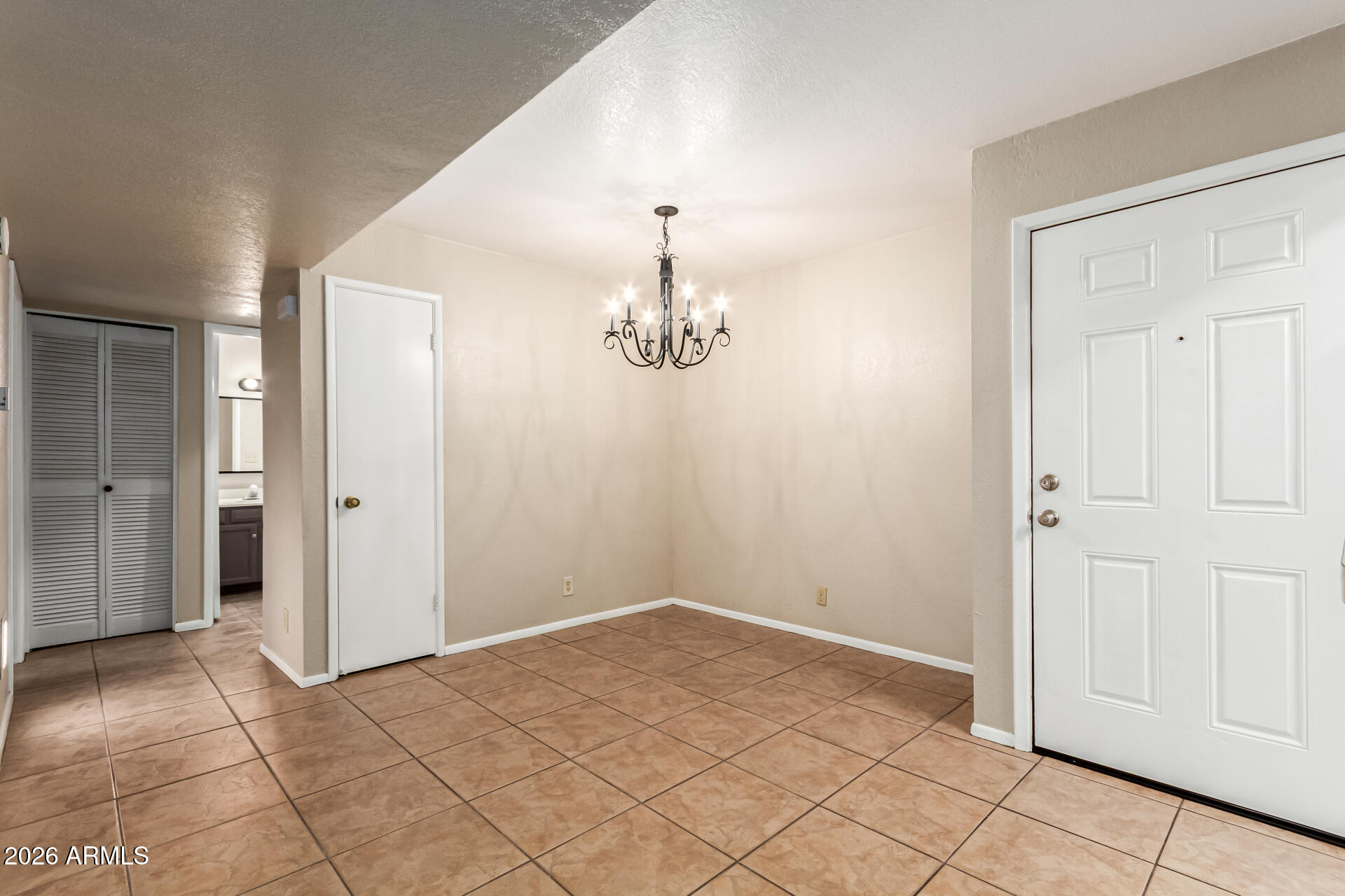 540 North May, Unit 3102 Mesa, AZ 85201 - Photo 12 of 45 an empty room with kitchen view