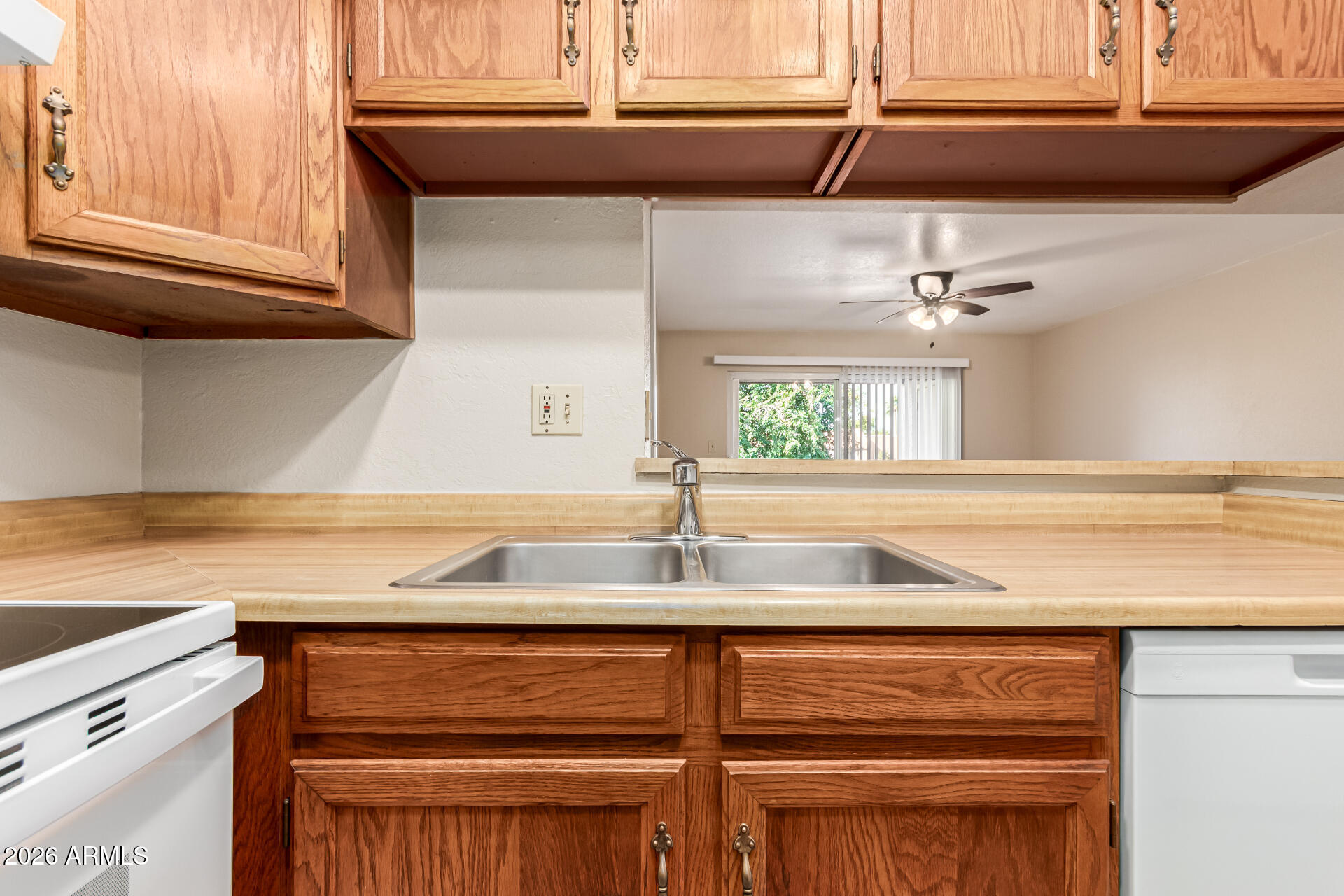 540 North May, Unit 3102 Mesa, AZ 85201 - Photo 15 of 45 a kitchen with a sink cabinets and a window