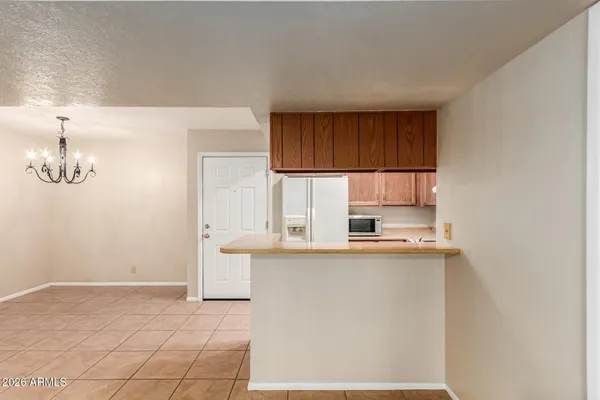 a kitchen with a sink cabinets and a window