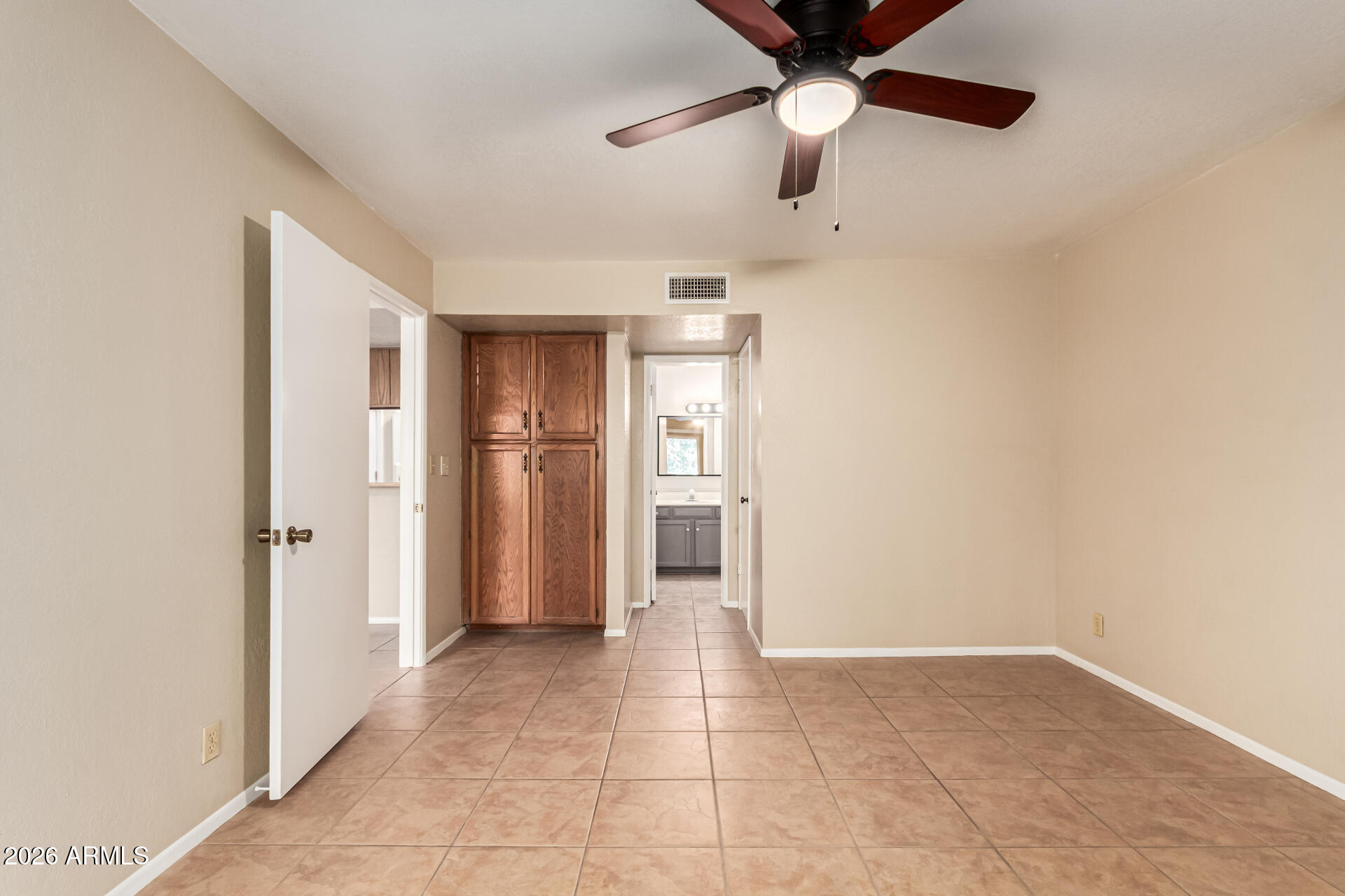 540 North May, Unit 3102 Mesa, AZ 85201 - Photo 19 of 45 a view of an empty room with a ceiling fan