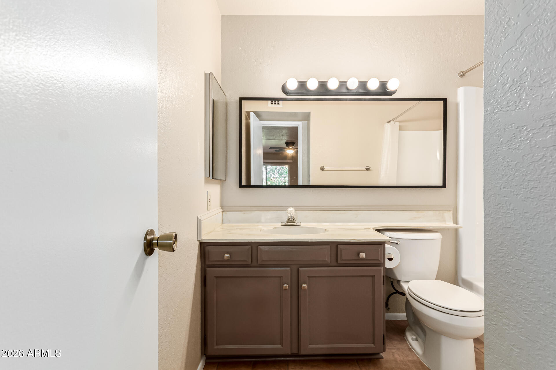 540 North May, Unit 3102 Mesa, AZ 85201 - Photo 20 of 45 a bathroom with a toilet sink and mirror