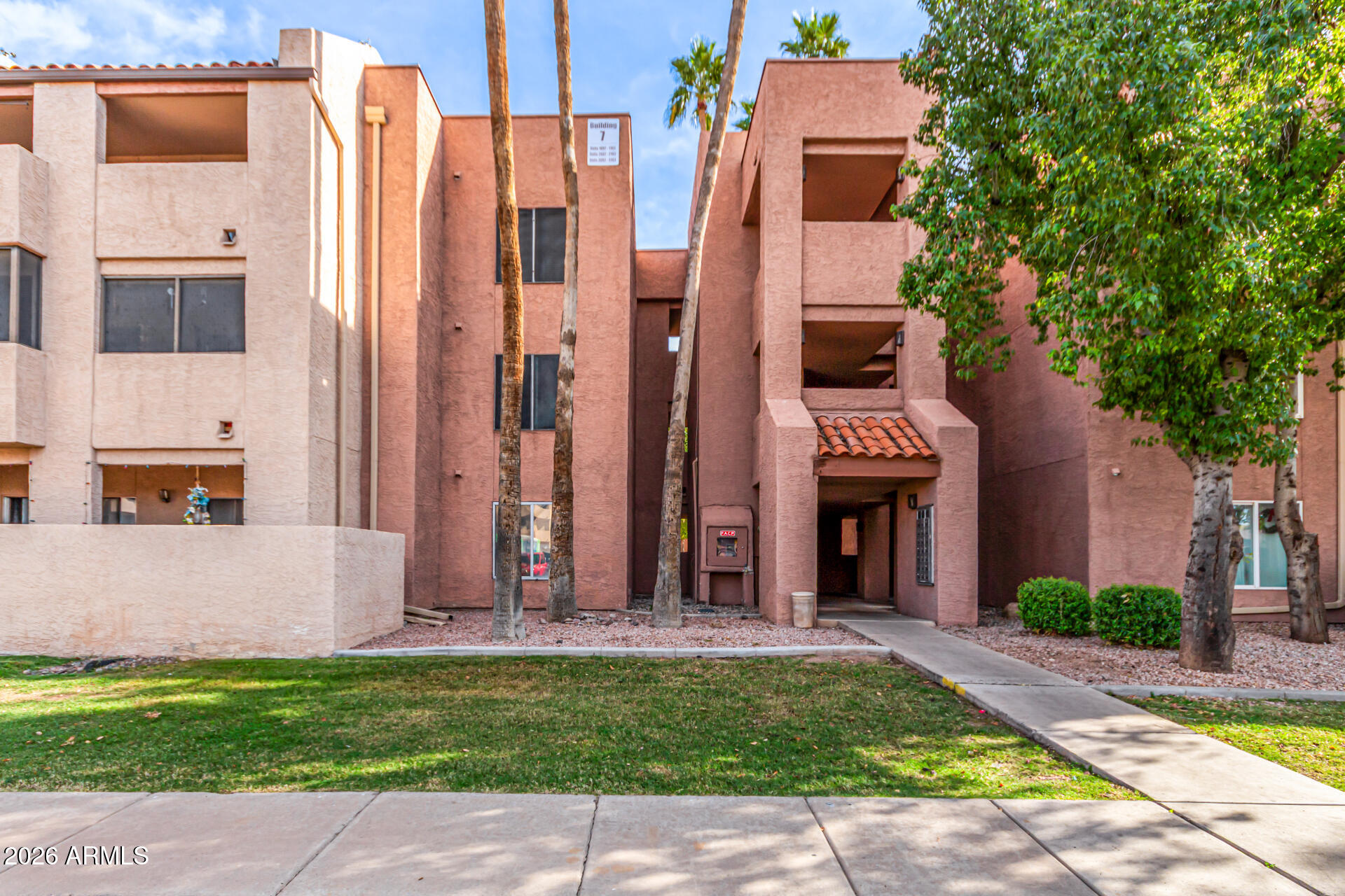 540 North May, Unit 3102 Mesa, AZ 85201 - Photo 34 of 45 a front view of a house with a garden