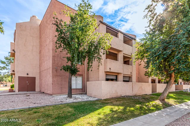 a view of a building with a yard