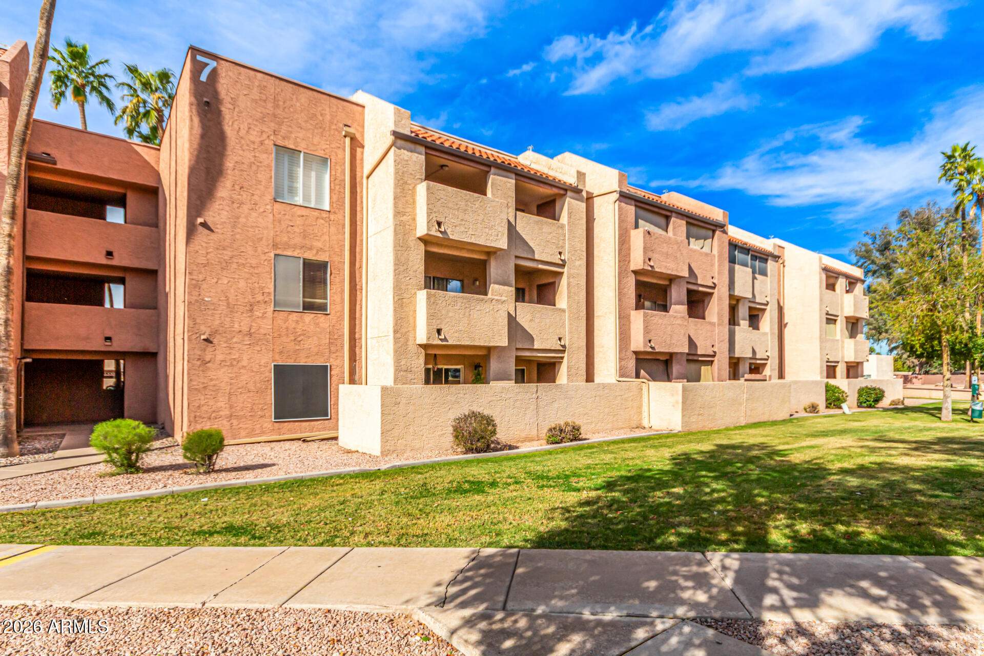 540 North May, Unit 3102 Mesa, AZ 85201 - Photo 37 of 45 a view of a building with a yard