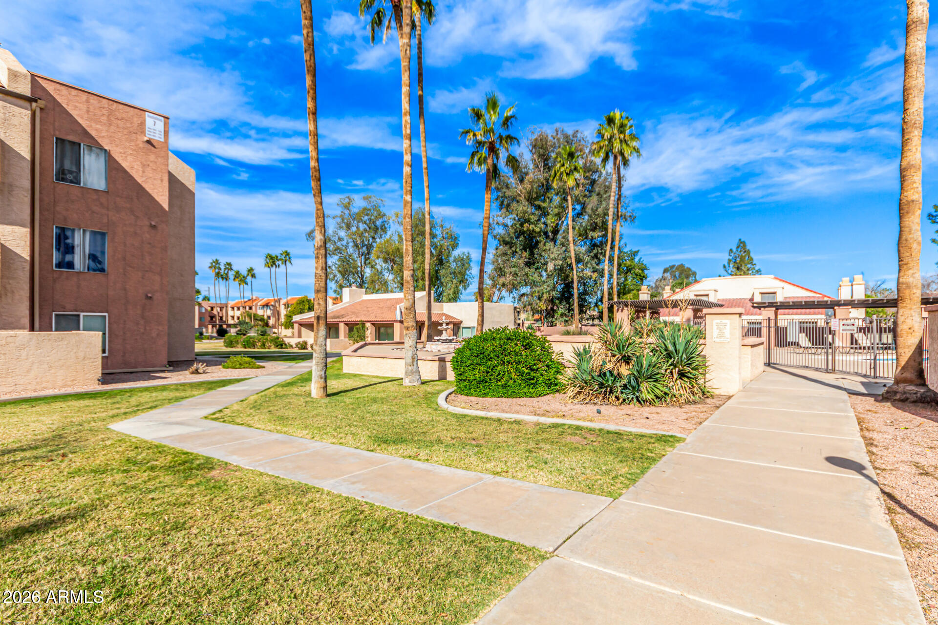 540 North May, Unit 3102 Mesa, AZ 85201 - Photo 38 of 45 a view of a swimming pool with a patio