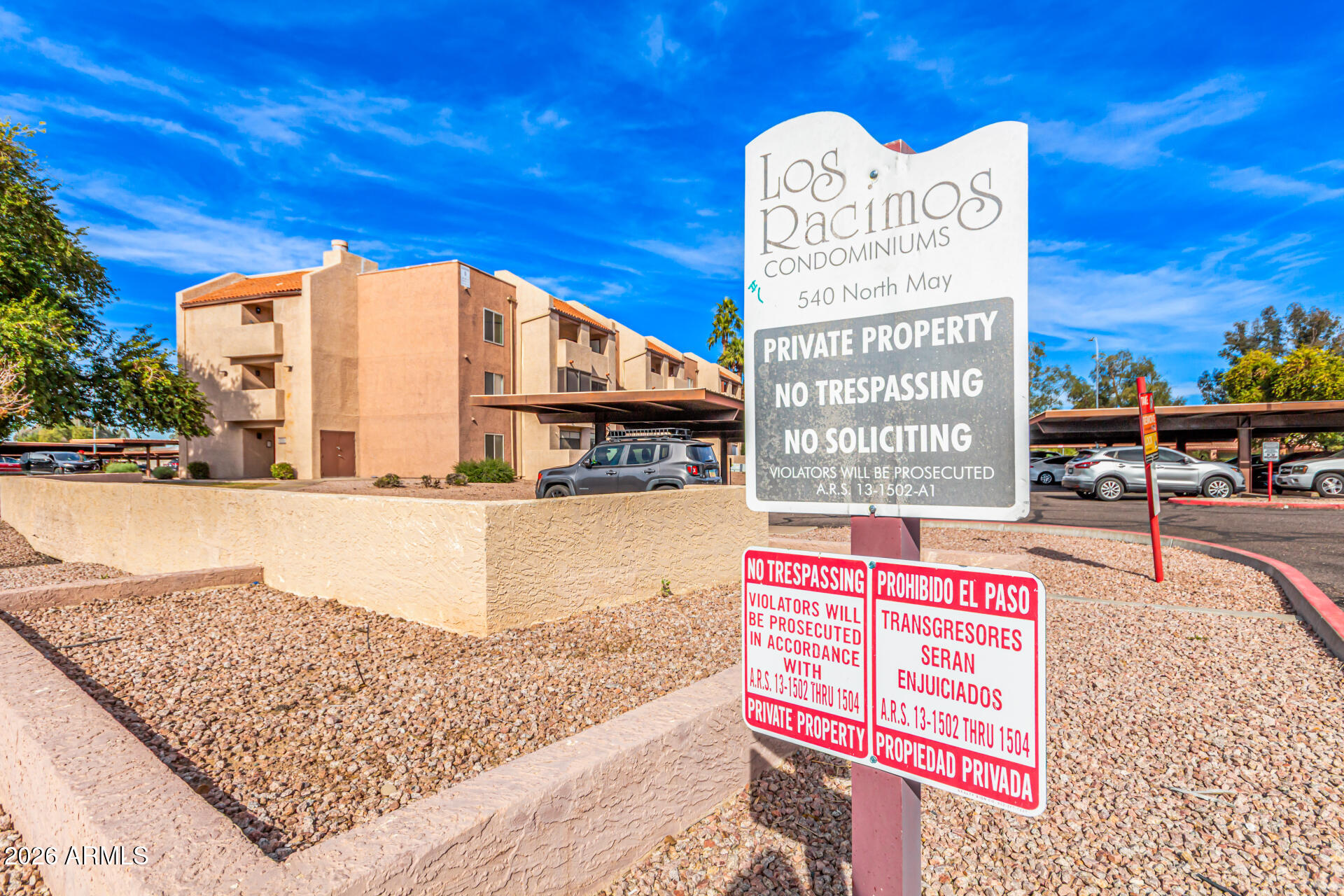 540 North May, Unit 3102 Mesa, AZ 85201 - Photo 45 of 45 a sign board with buildings in the background