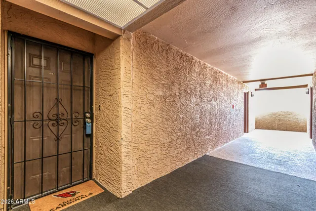 a front view of a house with a garden and yard