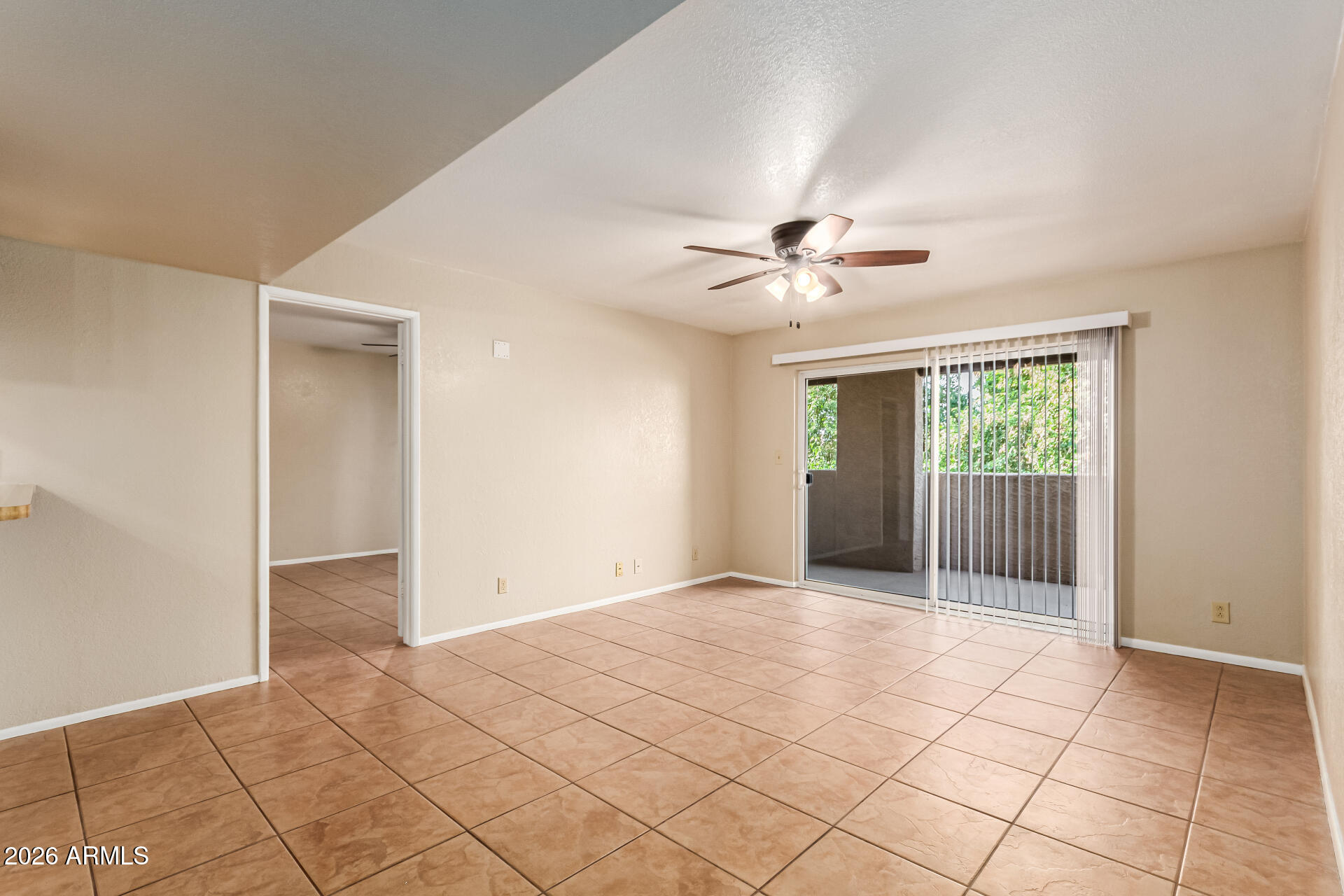540 North May, Unit 3102 Mesa, AZ 85201 - Photo 9 of 45 a view of an empty room with a ceiling fan