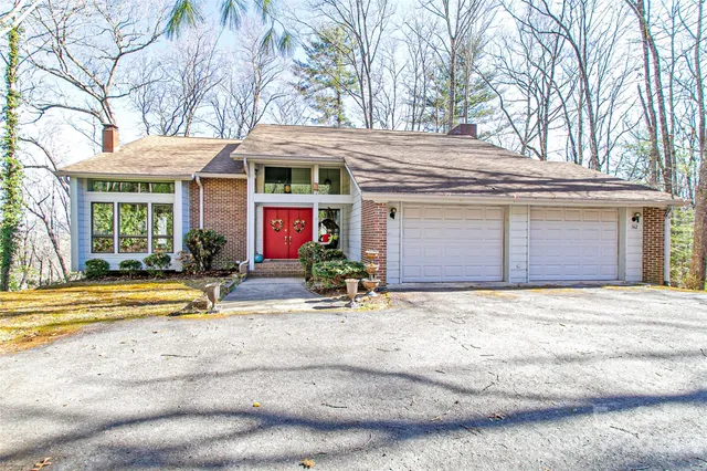 a front view of a house with basket ball court and outdoor seating