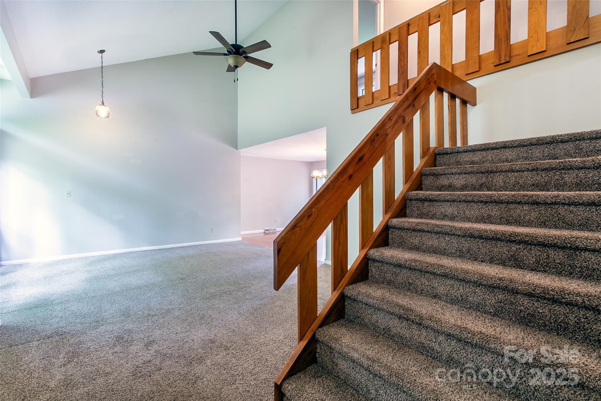 162 Southerland Road Pisgah Forest, NC 28768 - Photo 11 of 41 a view of staircase with lots of frames on wall and stairs