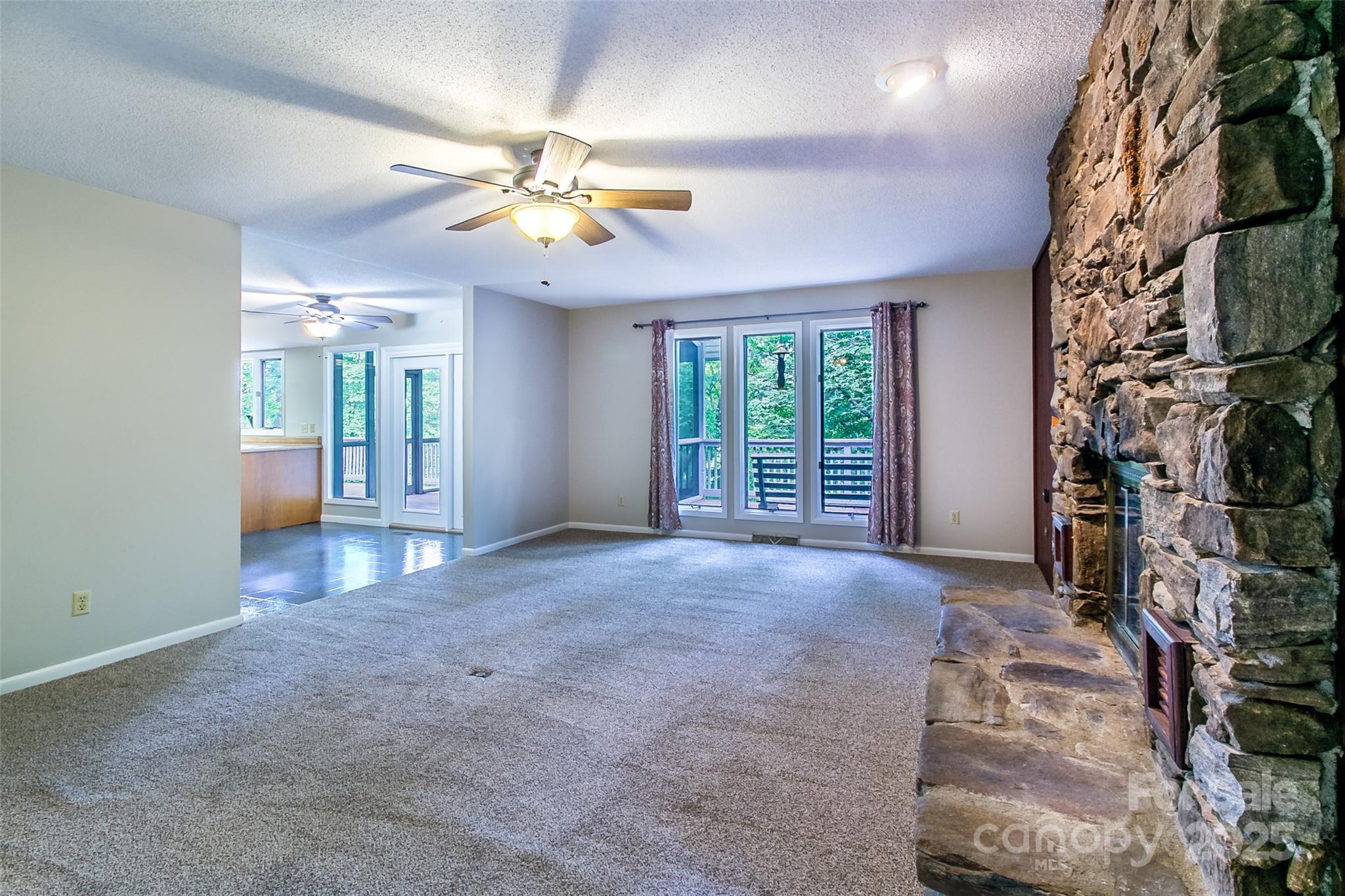 162 Southerland Road Pisgah Forest, NC 28768 - Photo 13 of 41 a view of an empty room with a window