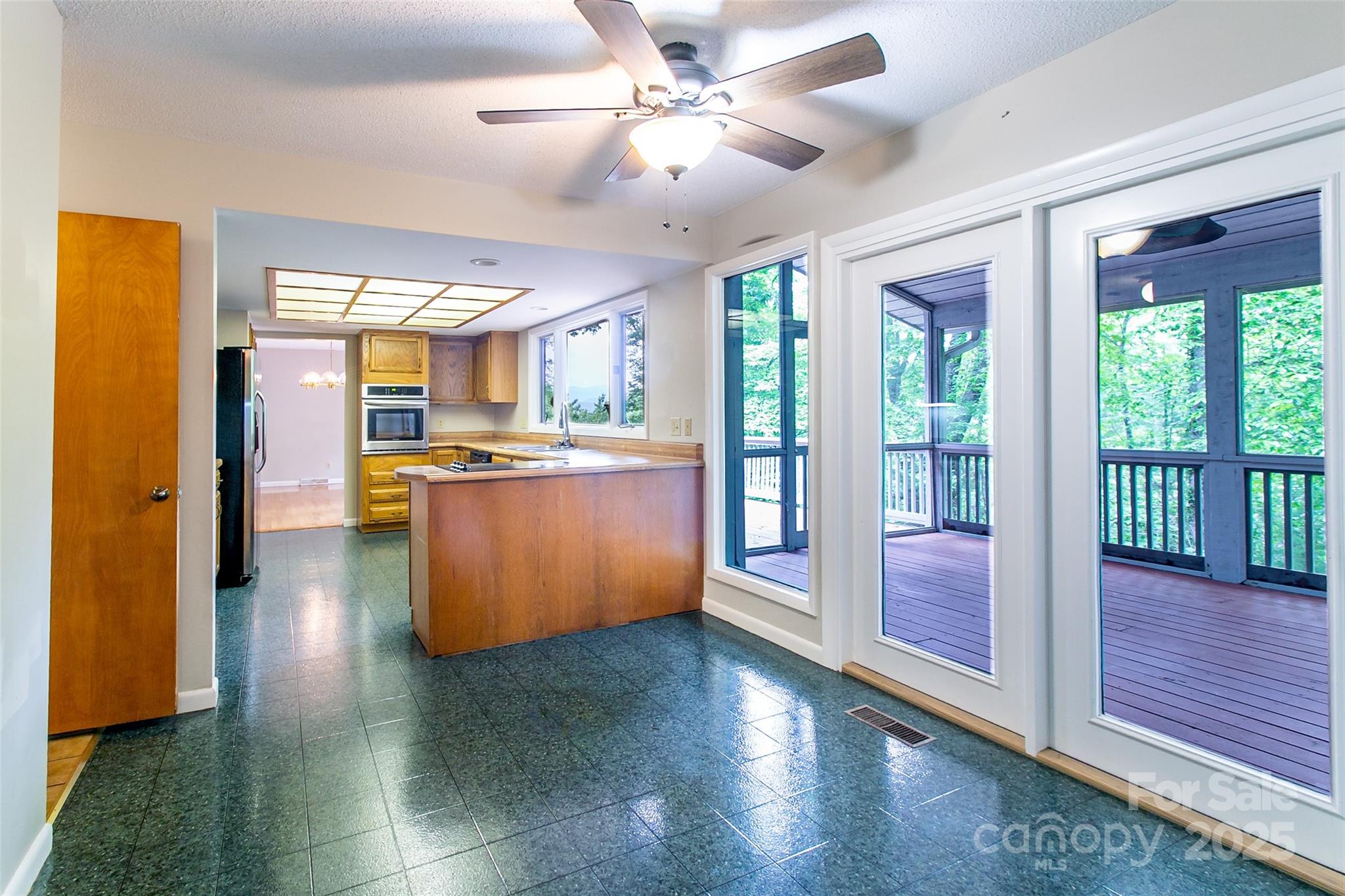 162 Southerland Road Pisgah Forest, NC 28768 - Photo 14 of 41 a kitchen with stainless steel appliances granite countertop a refrigerator a sink and a stove
