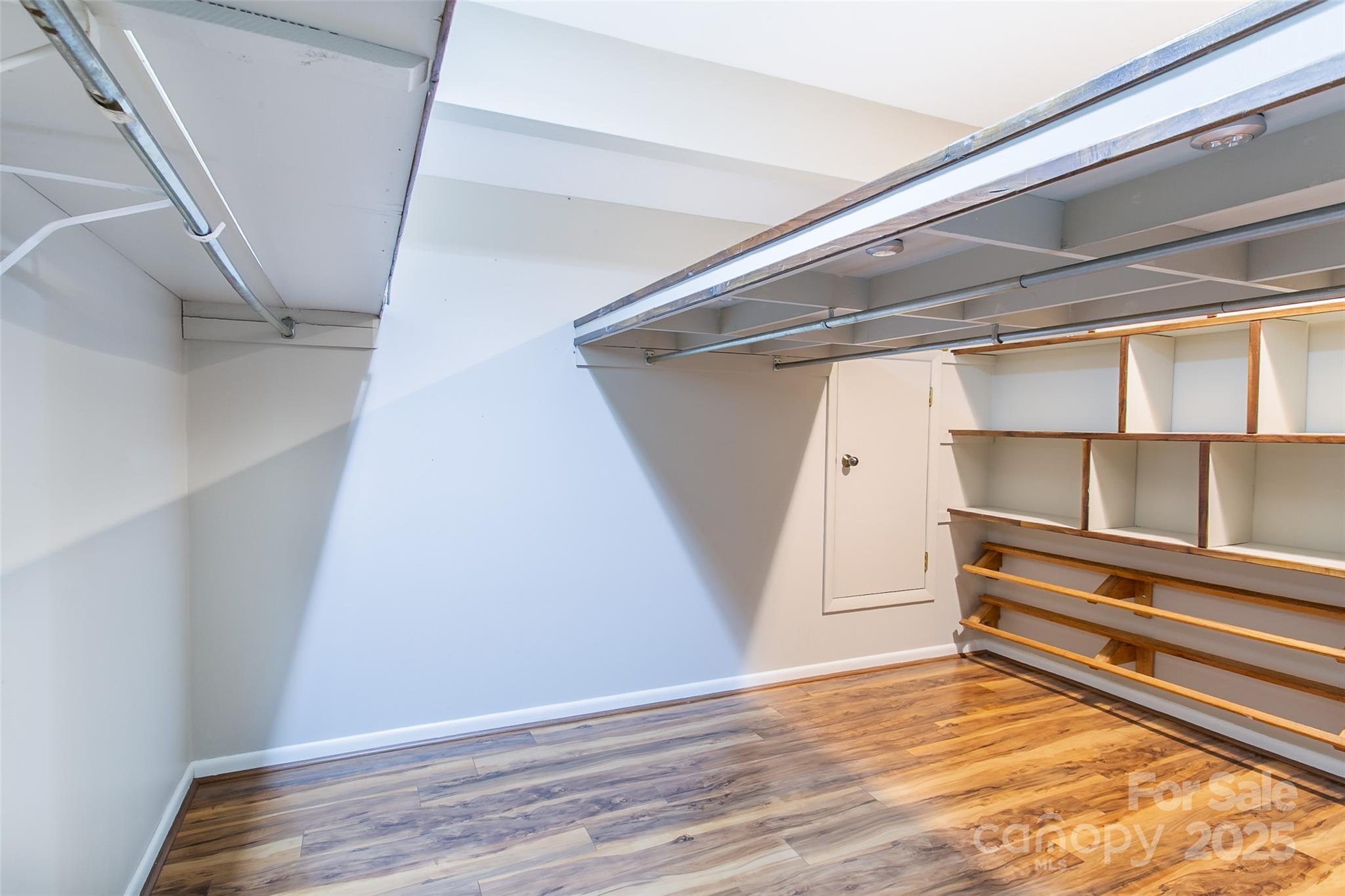 162 Southerland Road Pisgah Forest, NC 28768 - Photo 26 of 41 a view of walk in closet with empty racks