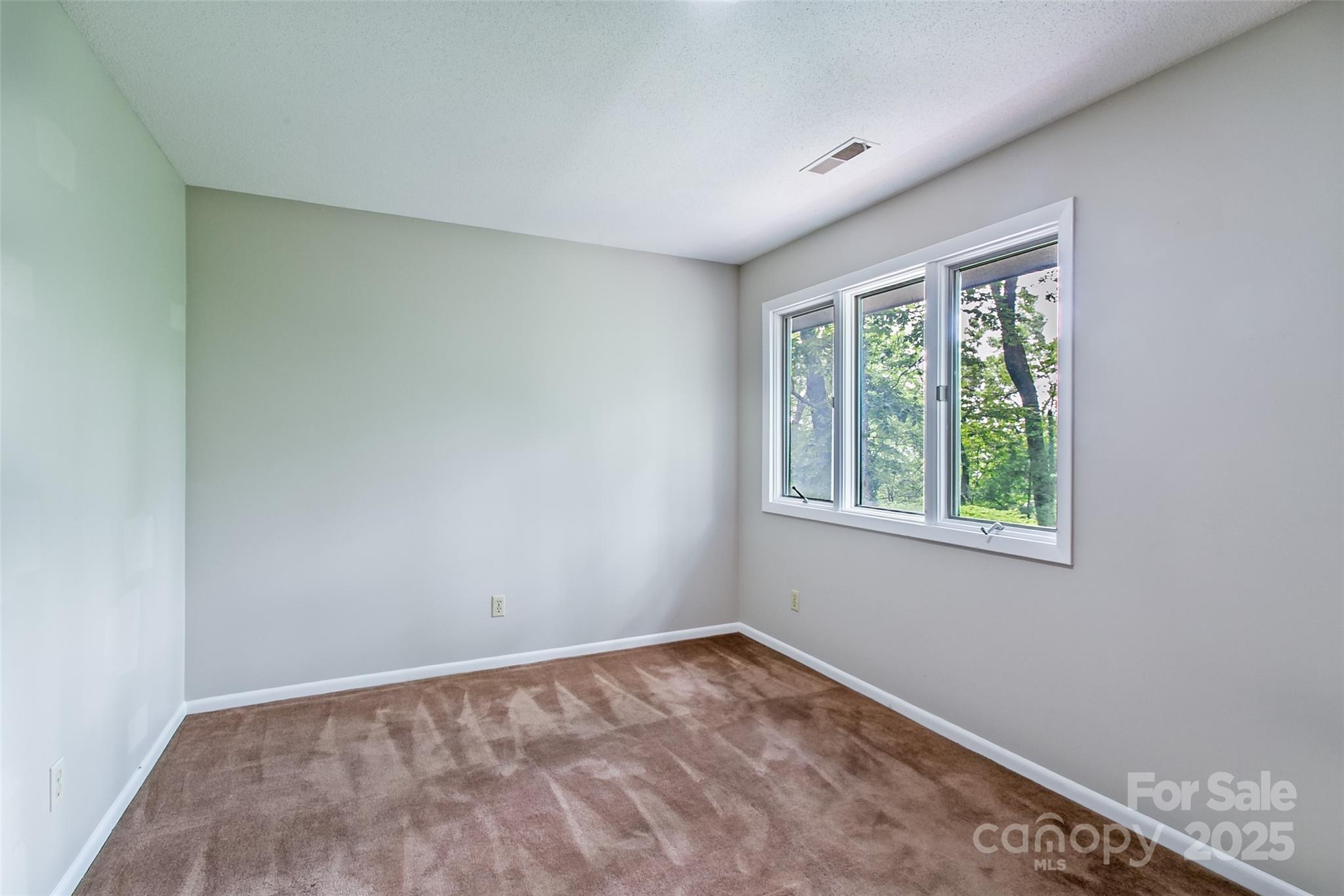 162 Southerland Road Pisgah Forest, NC 28768 - Photo 29 of 41 an empty room with a window