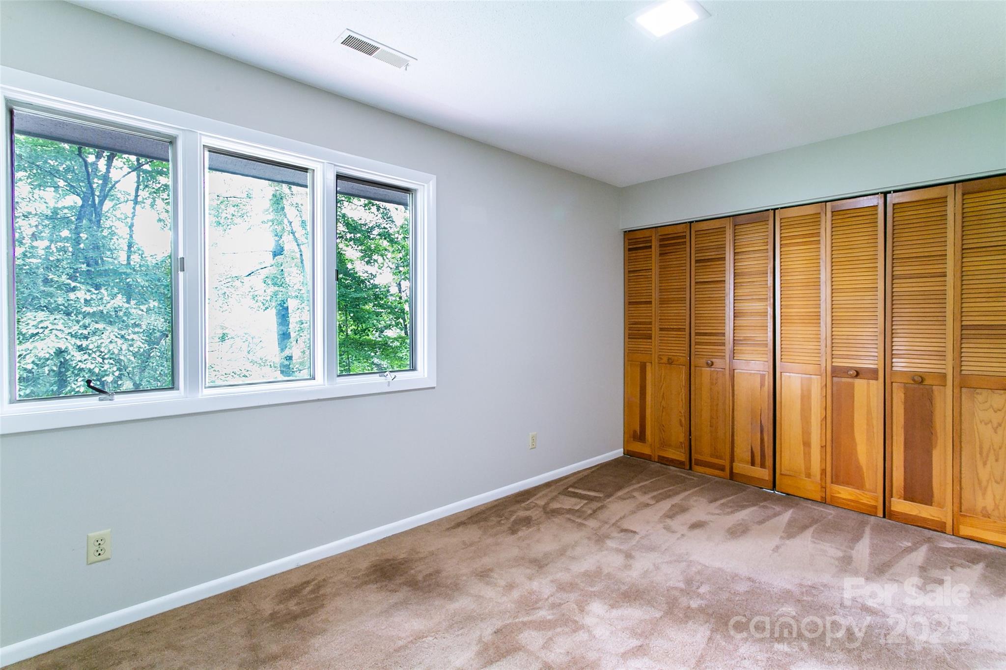 162 Southerland Road Pisgah Forest, NC 28768 - Photo 30 of 41 an empty room with a window