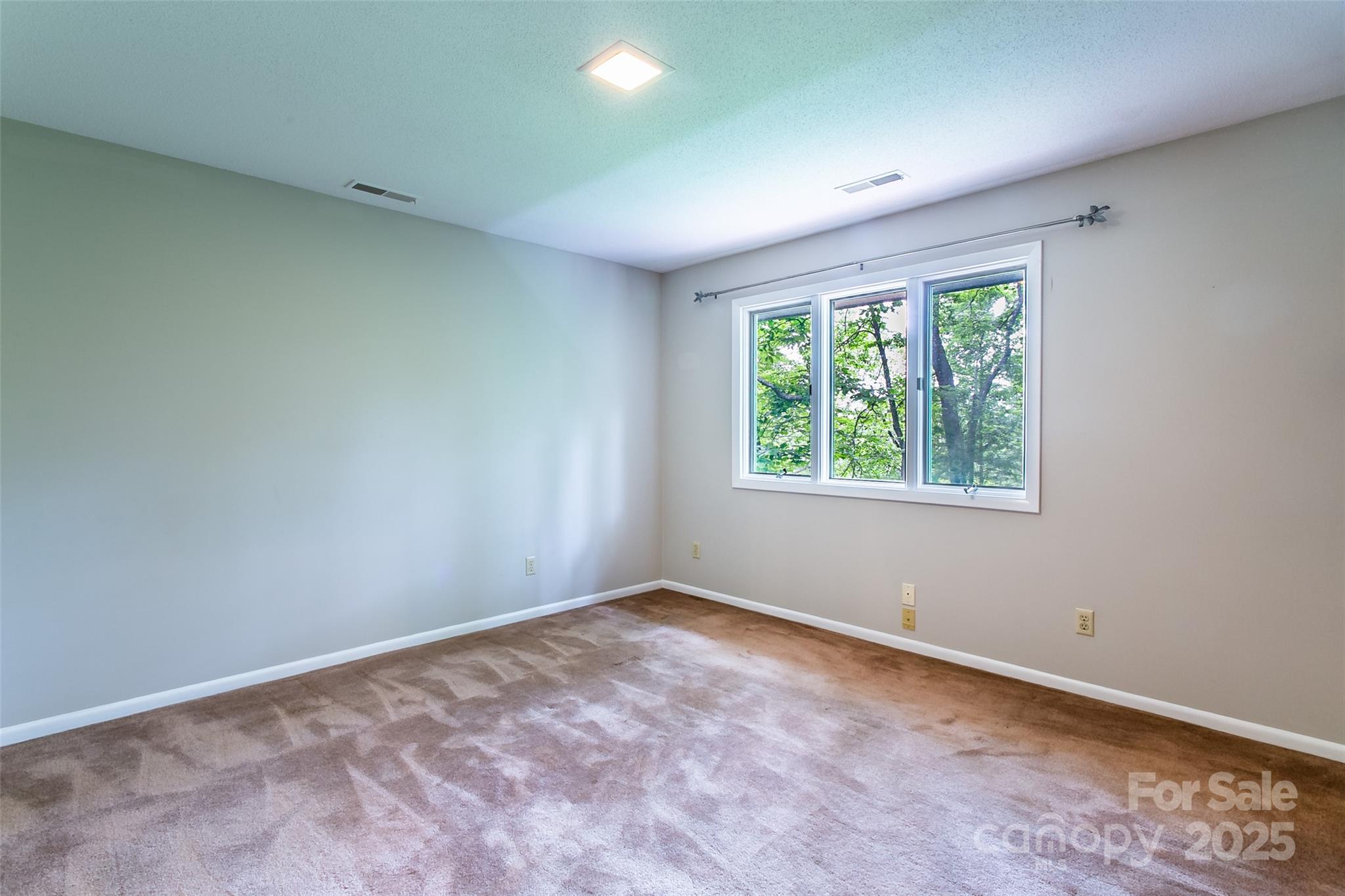 162 Southerland Road Pisgah Forest, NC 28768 - Photo 31 of 41 an empty room with a window
