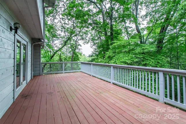 a view of backyard with a wooden deck