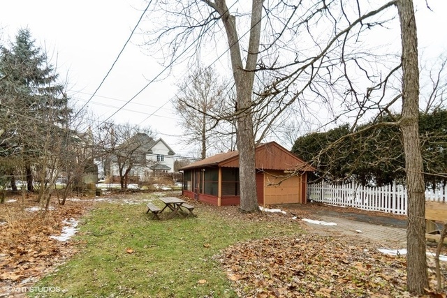 326 North County Line Road Hinsdale, IL 60521 - Photo 12 of 12 a backyard of a house with a large tree and of a house