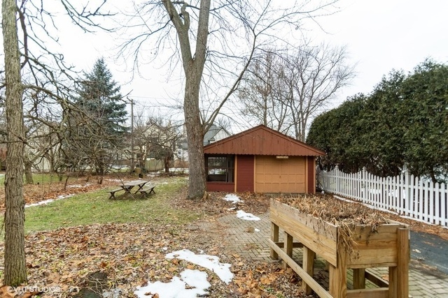326 North County Line Road Hinsdale, IL 60521 - Photo 10 of 12 a front view of a house with a yard