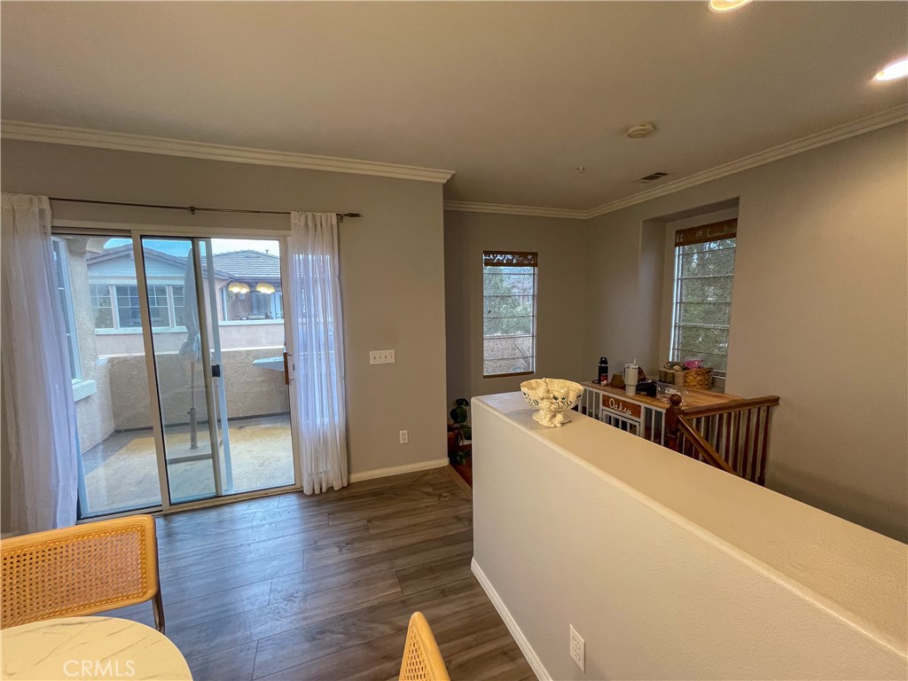 33570 Emerson Way, Unit C Temecula, CA 92592 - Photo 11 of 52 a very nice looking room with wooden floor