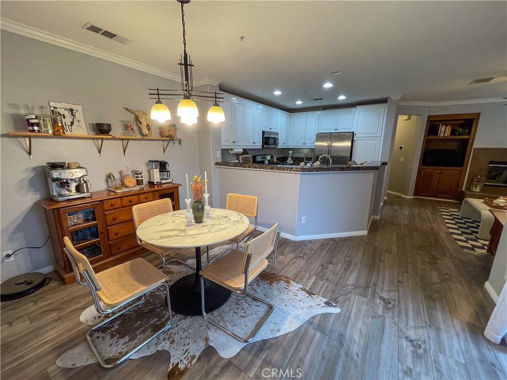 33570 Emerson Way, Unit C Temecula, CA 92592 - Photo 12 of 52 a kitchen with a table and chairs in it