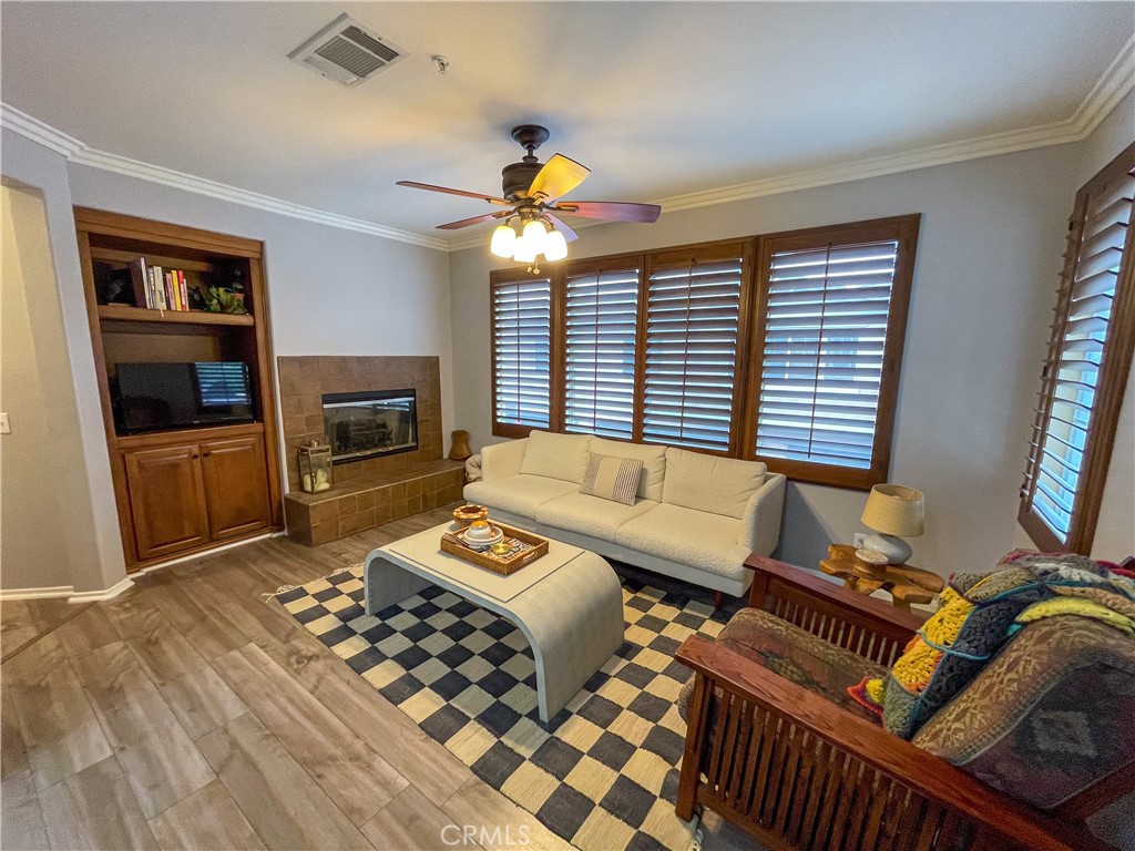 33570 Emerson Way, Unit C Temecula, CA 92592 - Photo 16 of 52 a living room with furniture and a flat screen tv