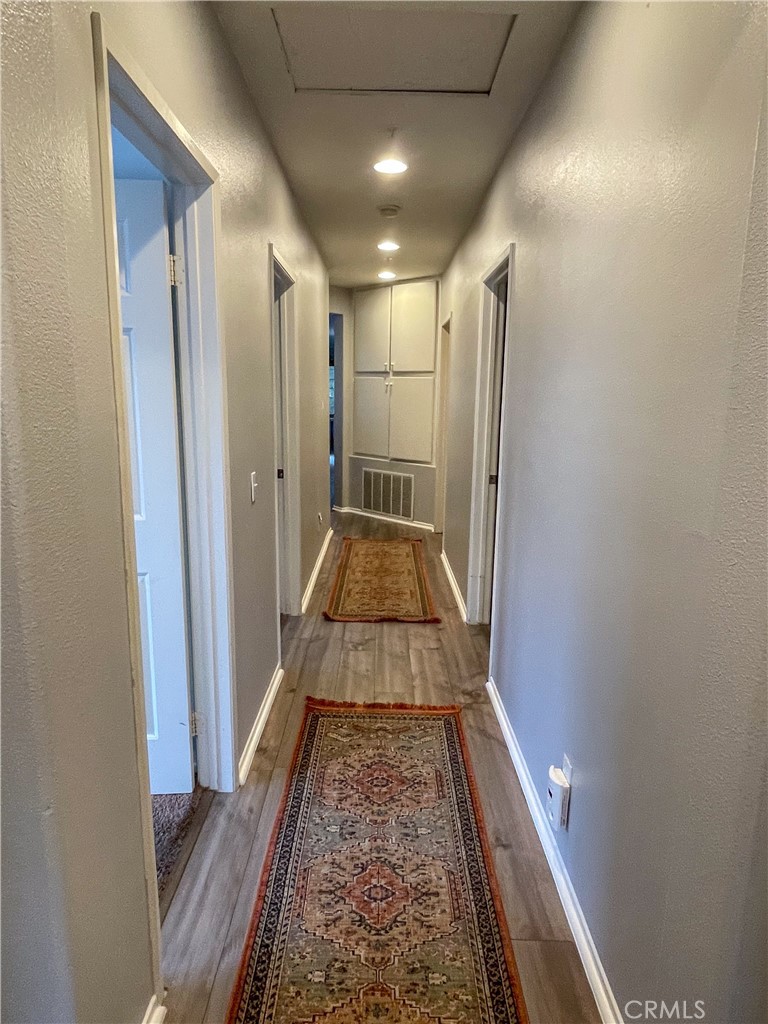 33570 Emerson Way, Unit C Temecula, CA 92592 - Photo 25 of 52 a view of hallway with wooden floor