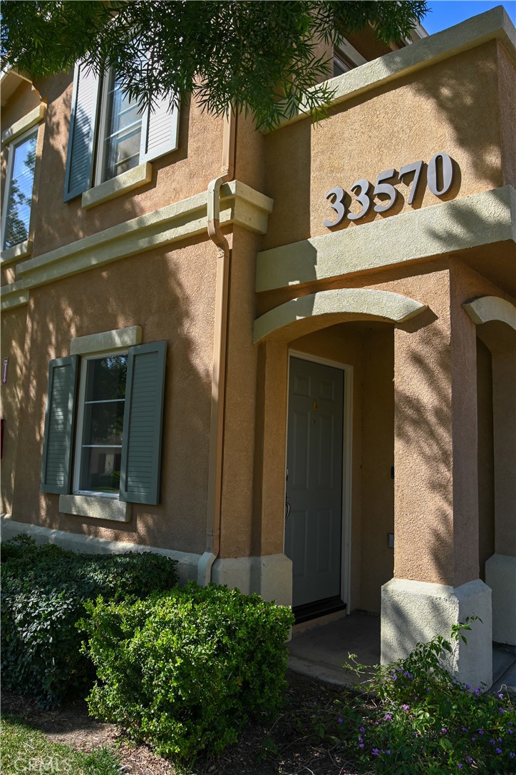 33570 Emerson Way, Unit C Temecula, CA 92592 - Photo 3 of 52 a view of a door and sign board