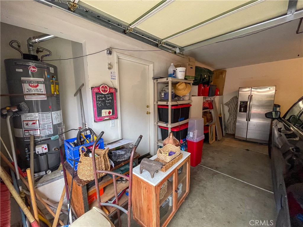33570 Emerson Way, Unit C Temecula, CA 92592 - Photo 33 of 52 a view of walk in closet with clothes and shoes