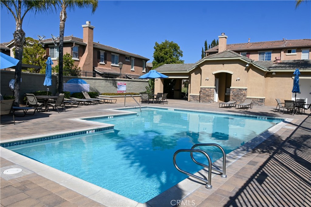 33570 Emerson Way, Unit C Temecula, CA 92592 - Photo 45 of 52 a view of a house with pool and sitting area