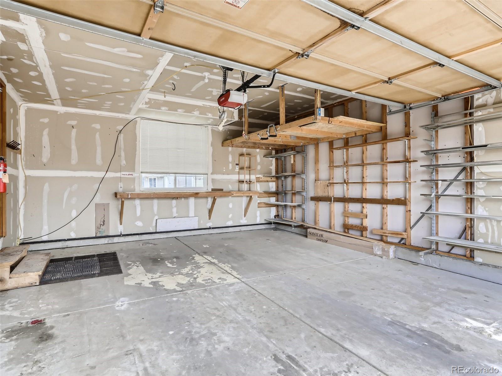 4399 Perth Circle Denver, CO 80249 - Photo 27 of 30 a view of a garage with wooden walls