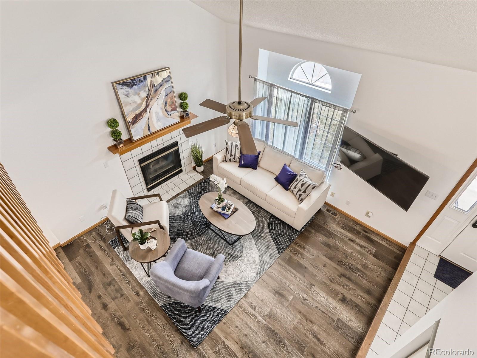 4399 Perth Circle Denver, CO 80249 - Photo 8 of 30 a living room with furniture and a window