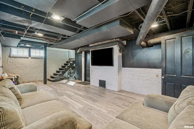 a bed room with a bed and a television