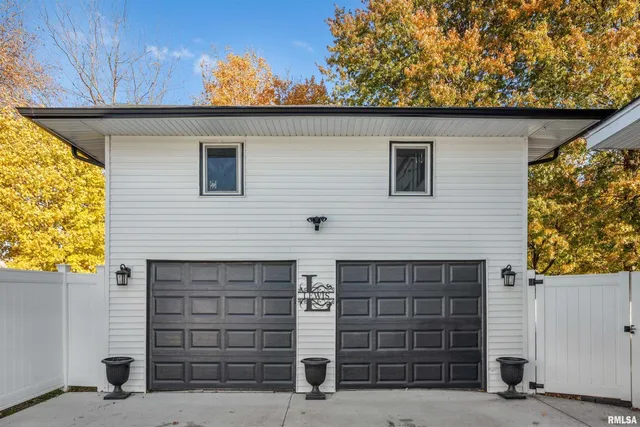 a front view of a house with a garage