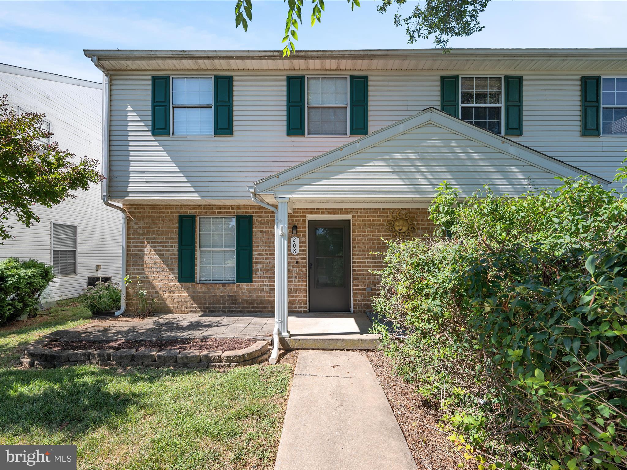 208 South Marshall Street Ranson, WV 25438 - Photo 1 of 28 a view of a house with a small yard plants and large tree